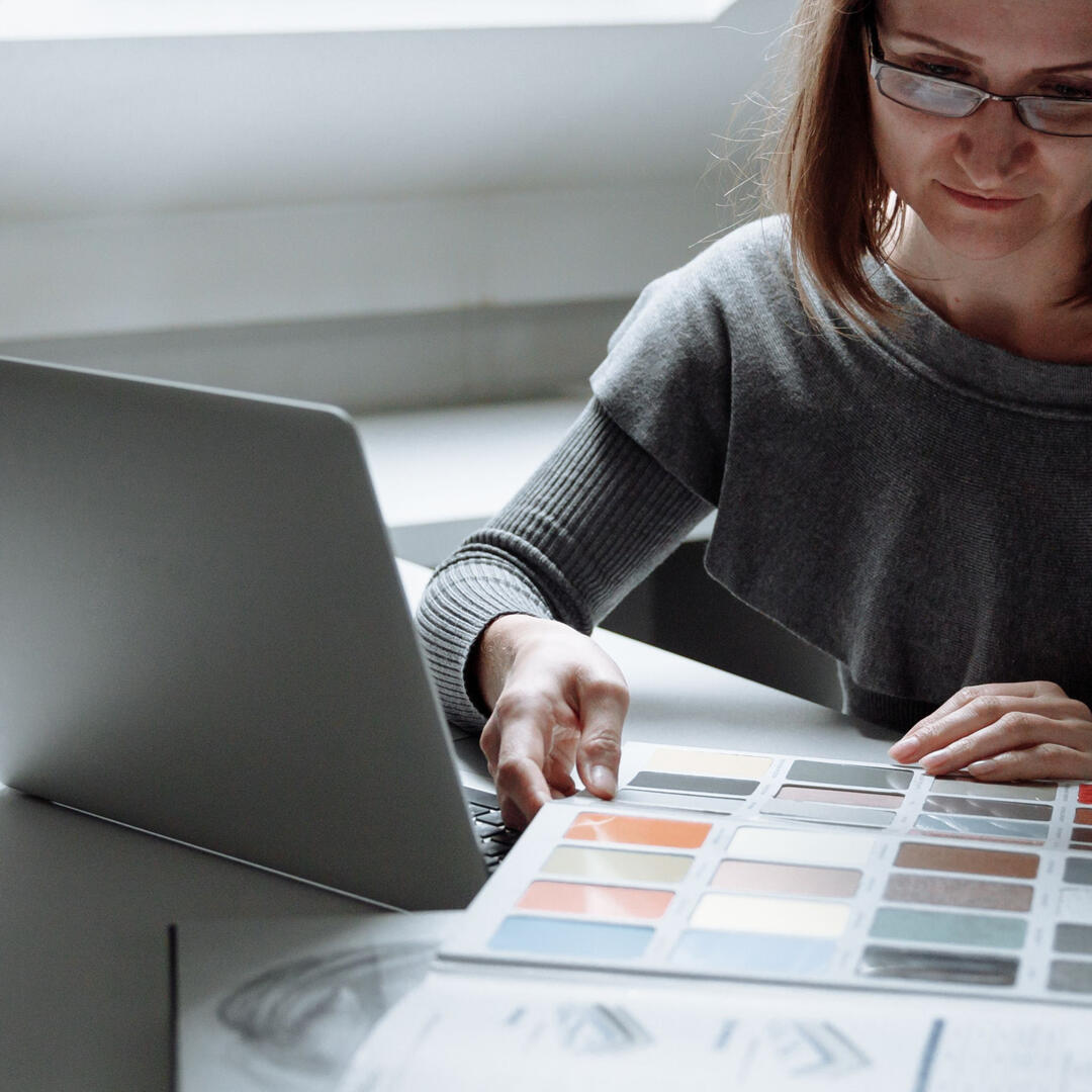 Sydney Renovation Design and Quote – Expert Kitchen and Bathroom Planning Person reviewing renovation design materials while preparing a concept plan and cost estimate for a Sydney kitchen or bathroom renovation