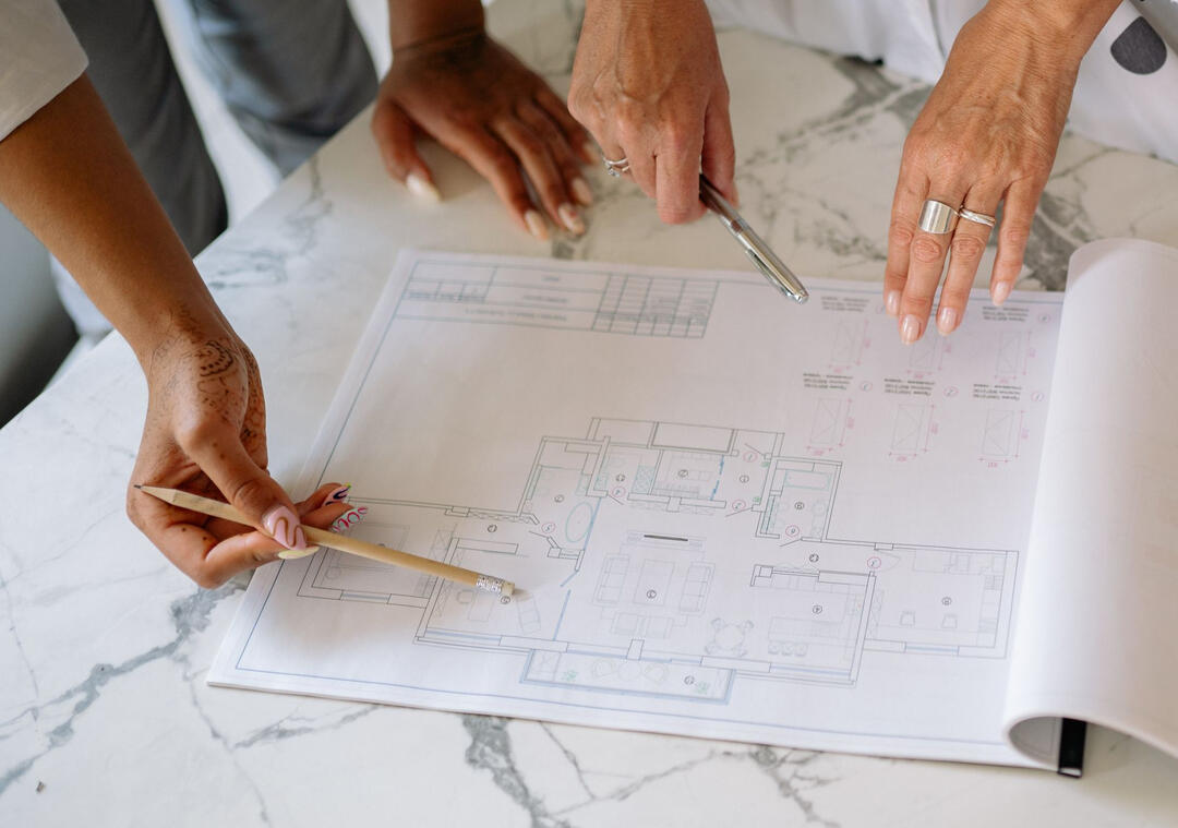 Final Construction Drawings for Sydney Kitchen and Bathroom Renovations Reviewing detailed construction drawings during the final scope validation for a Sydney kitchen and bathroom renovation