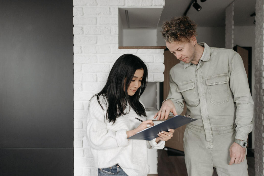 Sydney Renovation Pre‑Construction Planning – Kitchen and Bathroom Projects Two people reviewing a renovation checklist during the pre‑construction planning phase for a Sydney kitchen or bathroom project