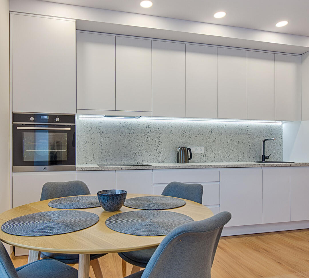 Contemporary kitchen renovation with premium cabinetry and lighting, representing affordable kitchen renovation packages and custom kitchen remodeling services in Sydney.